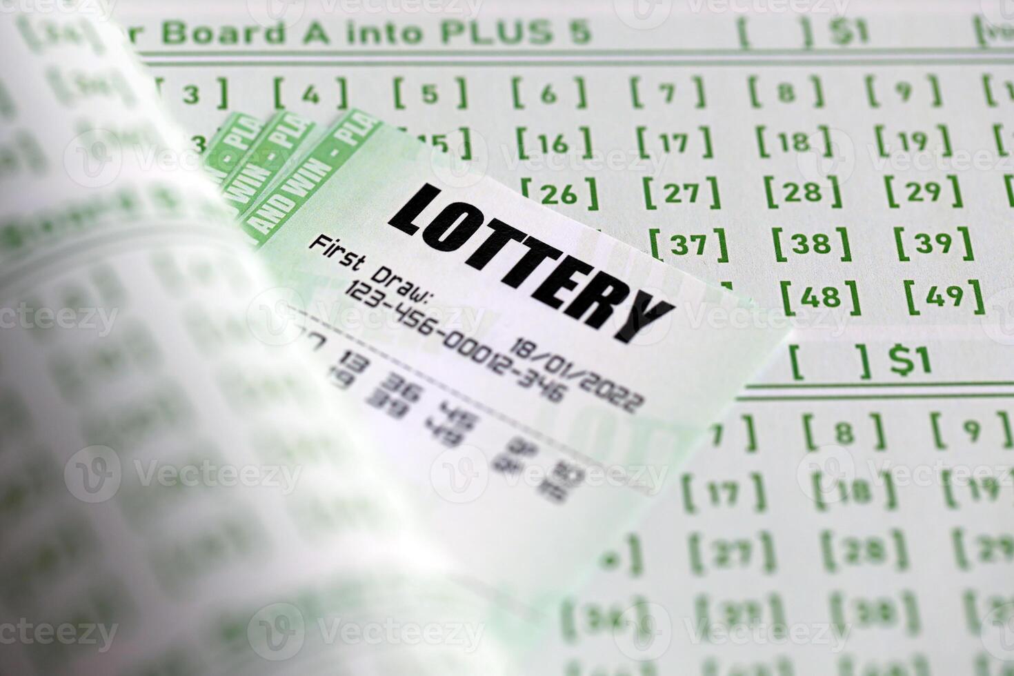 Green lottery tickets and blank bills with numbers for playing lottery photo