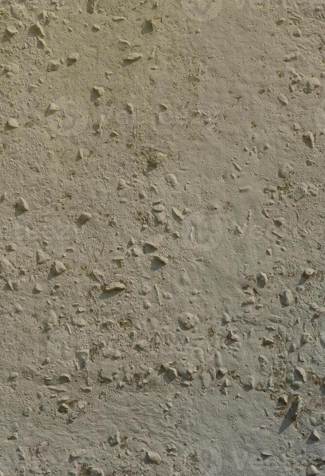 Texture of the old embossed concrete wall in gray color. Background image of a concrete product photo