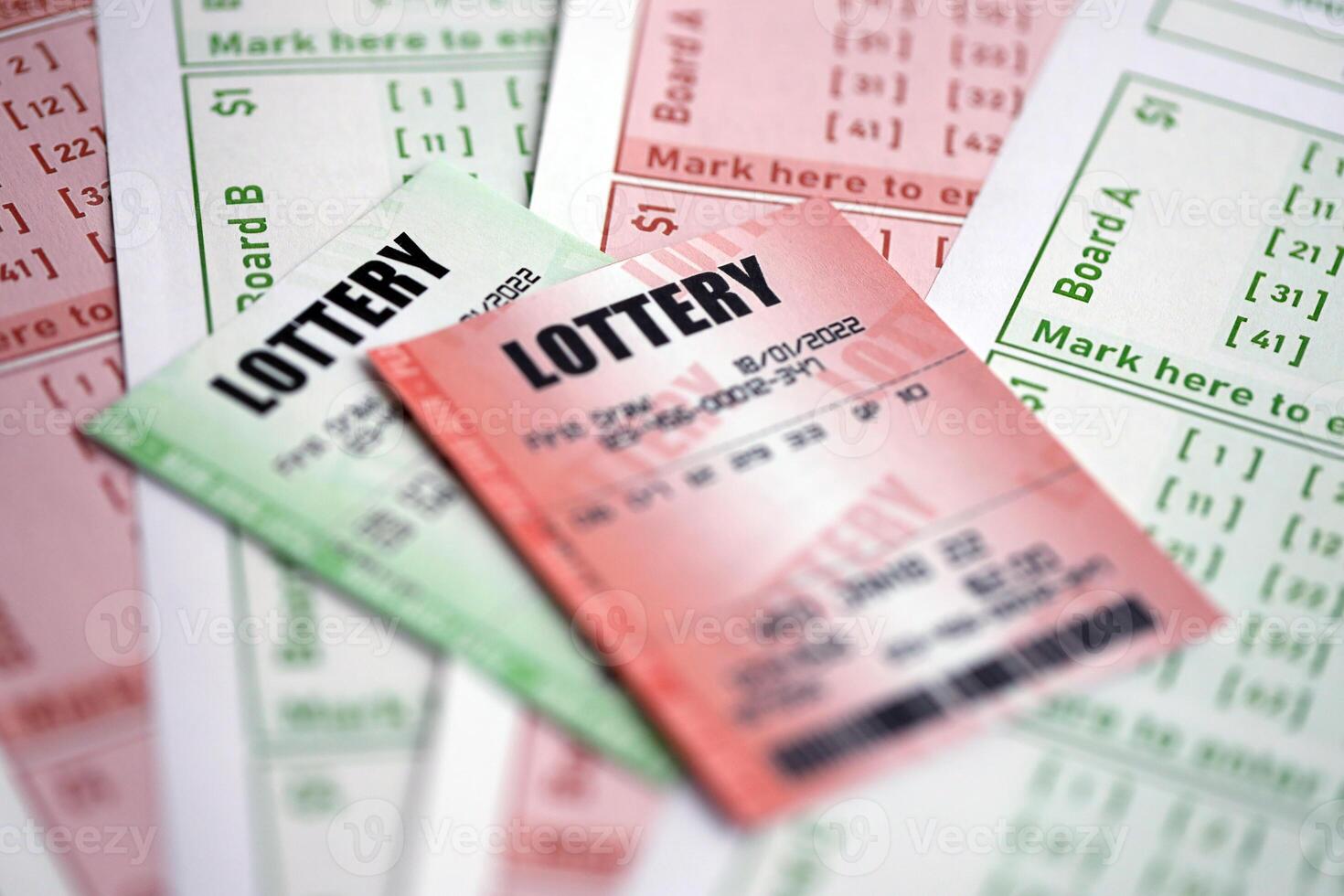 Green and red lottery tickets on blank bills with numbers for playing lottery photo