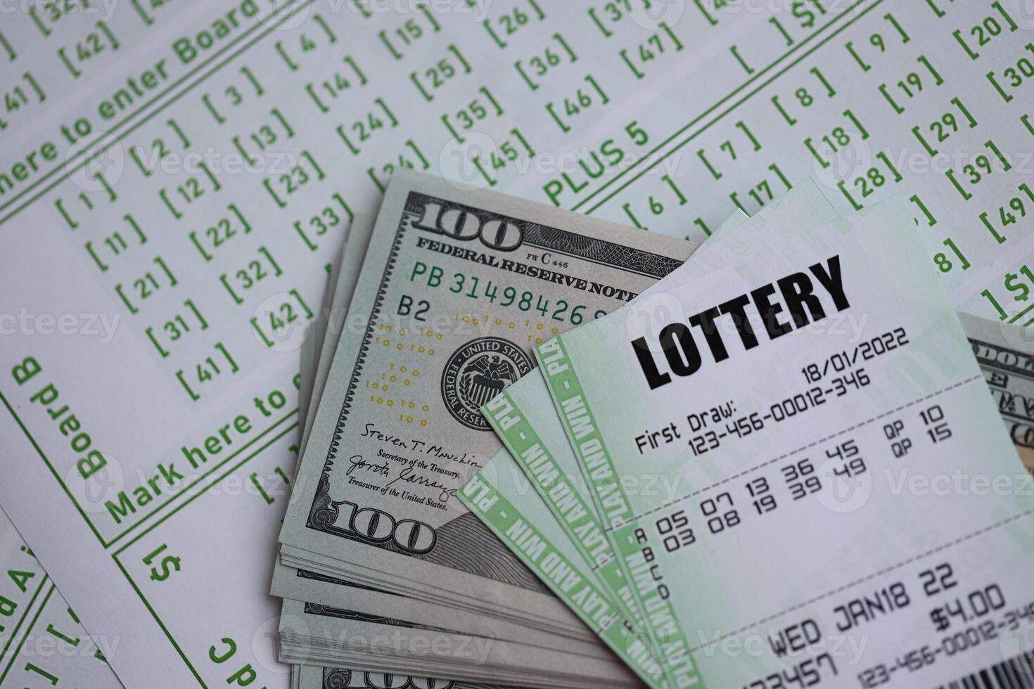 Green lottery tickets and US money bills on blank with numbers for playing lottery photo
