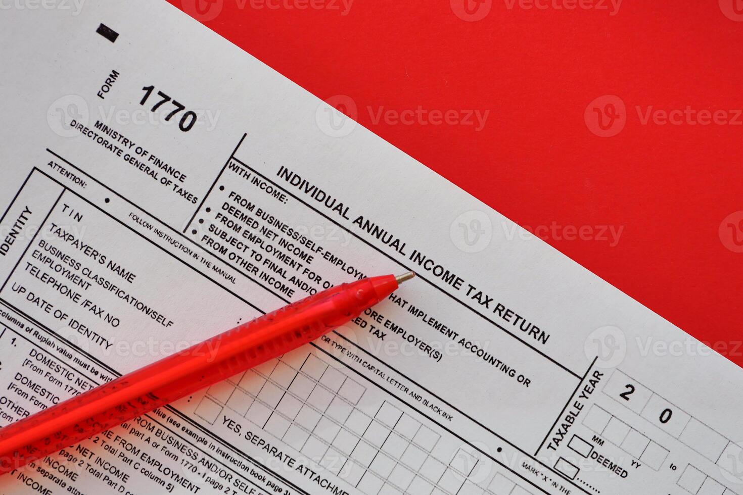 Indonesian tax form 1770 Individual Income Tax Return and pen on table photo