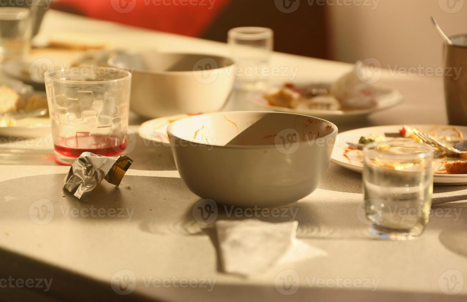 Empty dirty plates with spoons and forks on the table after meal. Banquet ending concept. Unwashed dishes photo