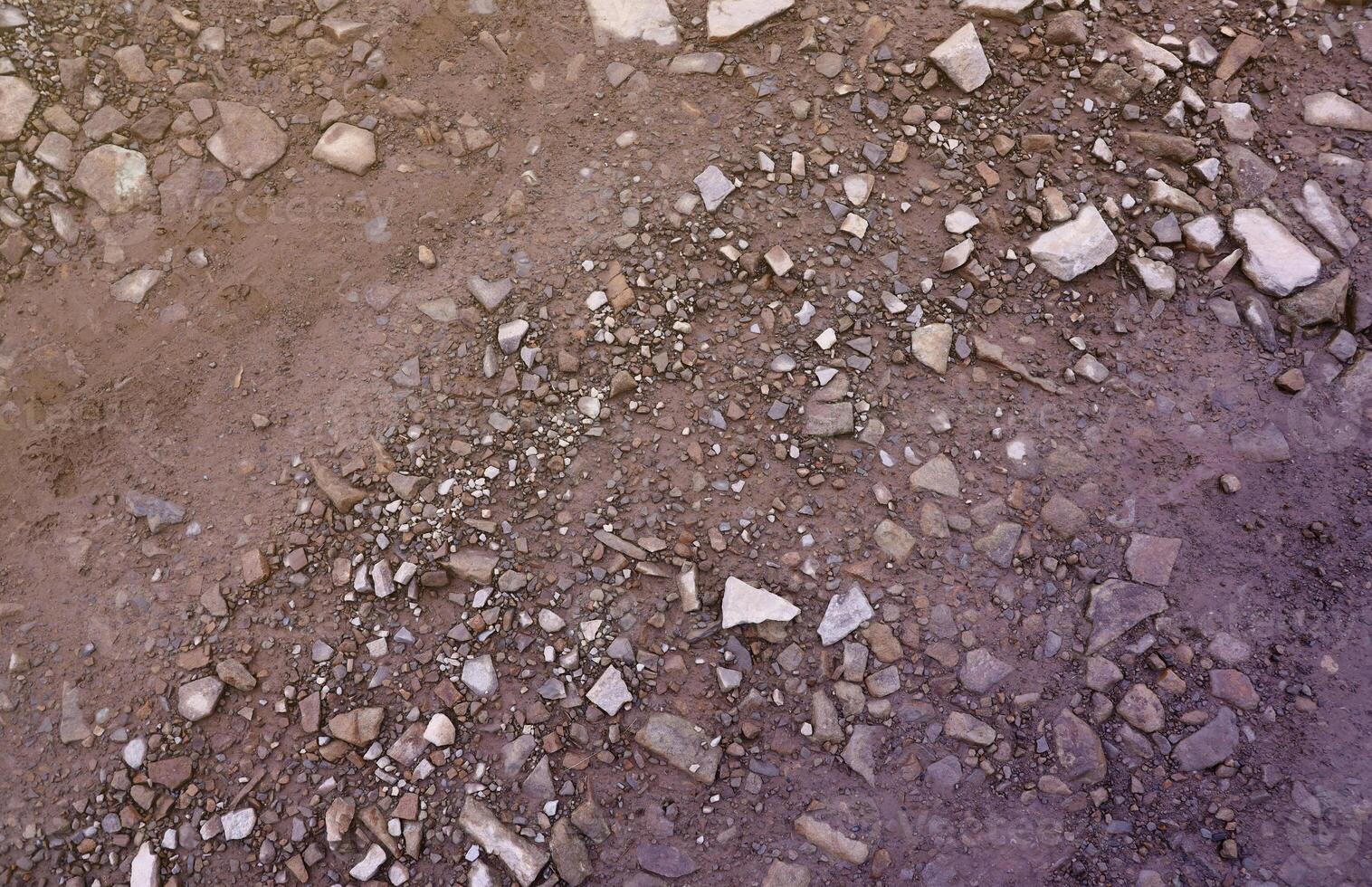 Background of shattered stony stones surface in mountain area. Texture with natural light photo