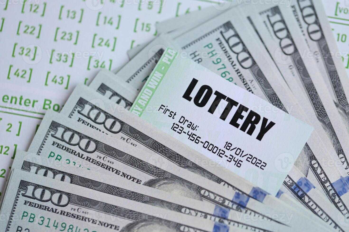 Green lottery tickets and US money bills on blank with numbers for playing lottery photo