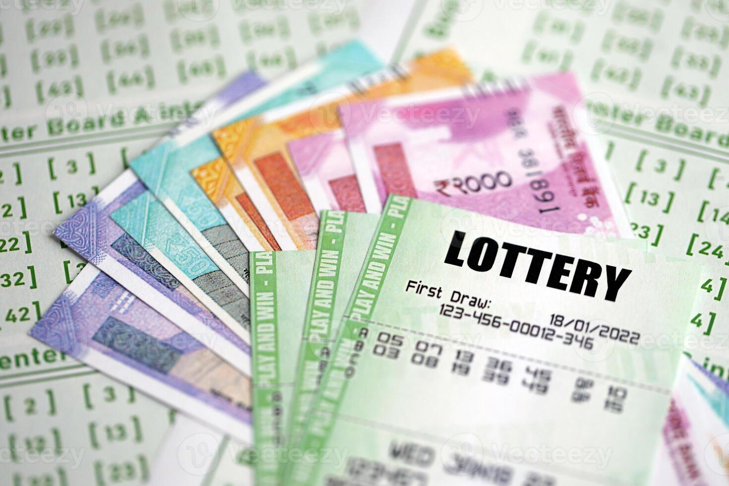 Man hands with indian rupees bills and lottery ticket. Concept of gambling  and winning money in indian lottery 35933928 Stock Photo at Vecteezy