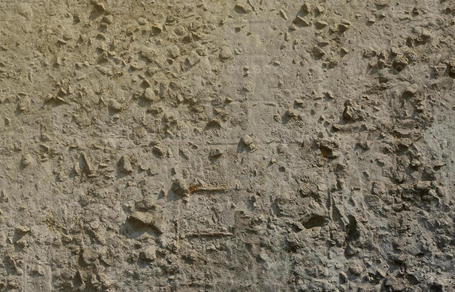 Texture of the old embossed concrete wall in gray color. Background image of a concrete product photo