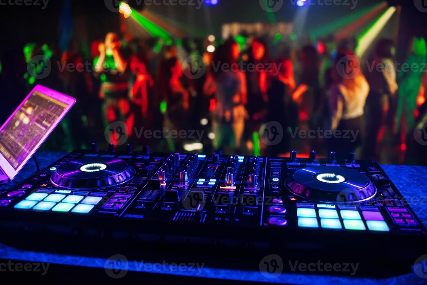 music controller DJ mixer in a night club photo