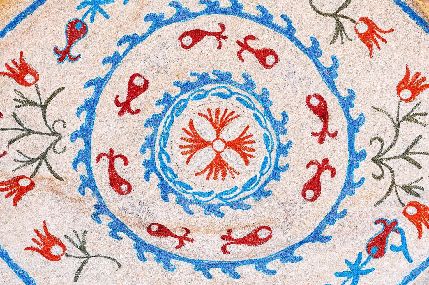 vintage white rug with traditional Arabic Uzbek pattern in Uzbekistan close up photo