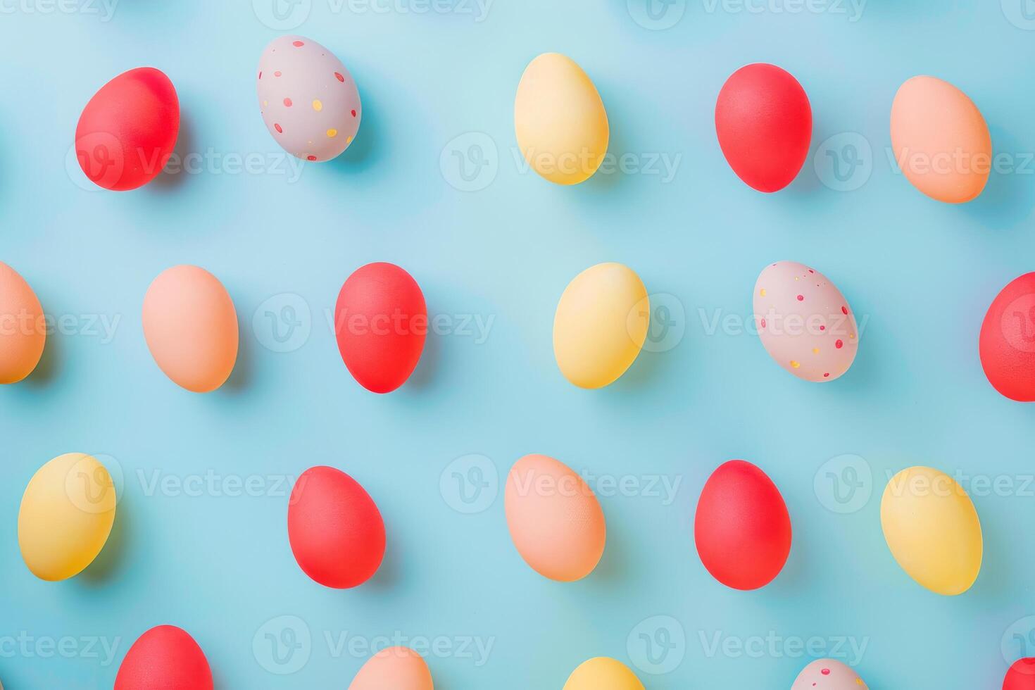 Colorful Easter eggs arranged in a playful pattern against a pastel backdrop photo