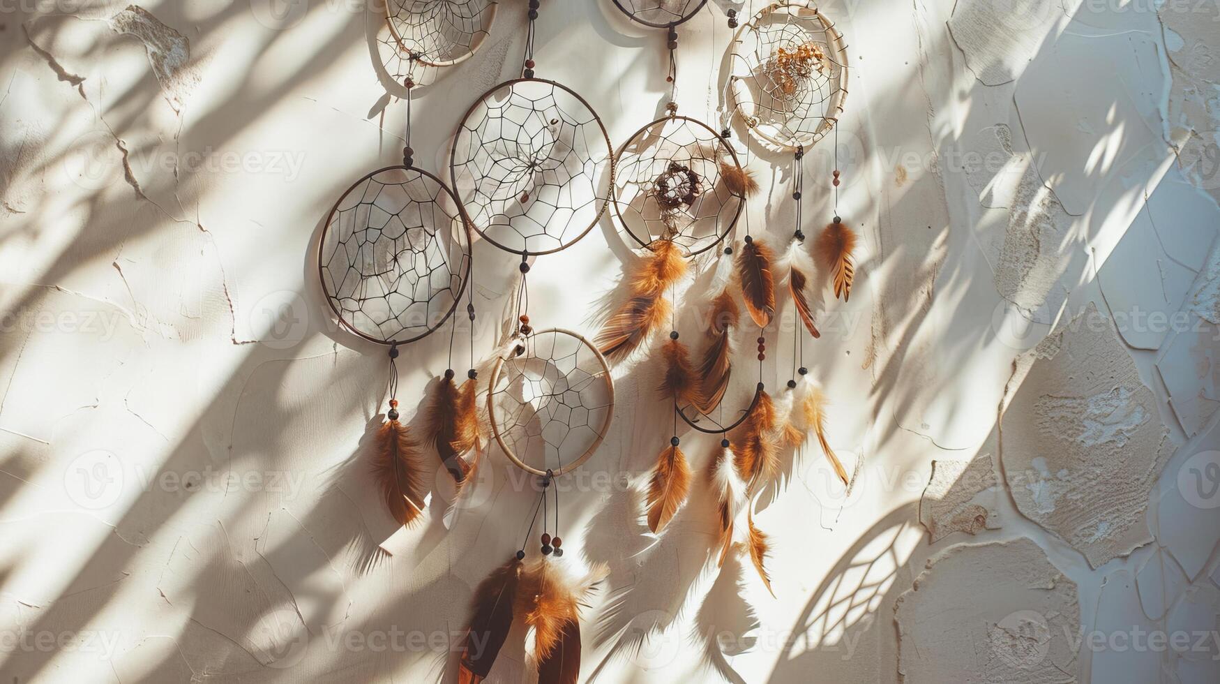Artistic and handmade boho dreamcatchers bring a sense of warmth and coziness to designs on white photo
