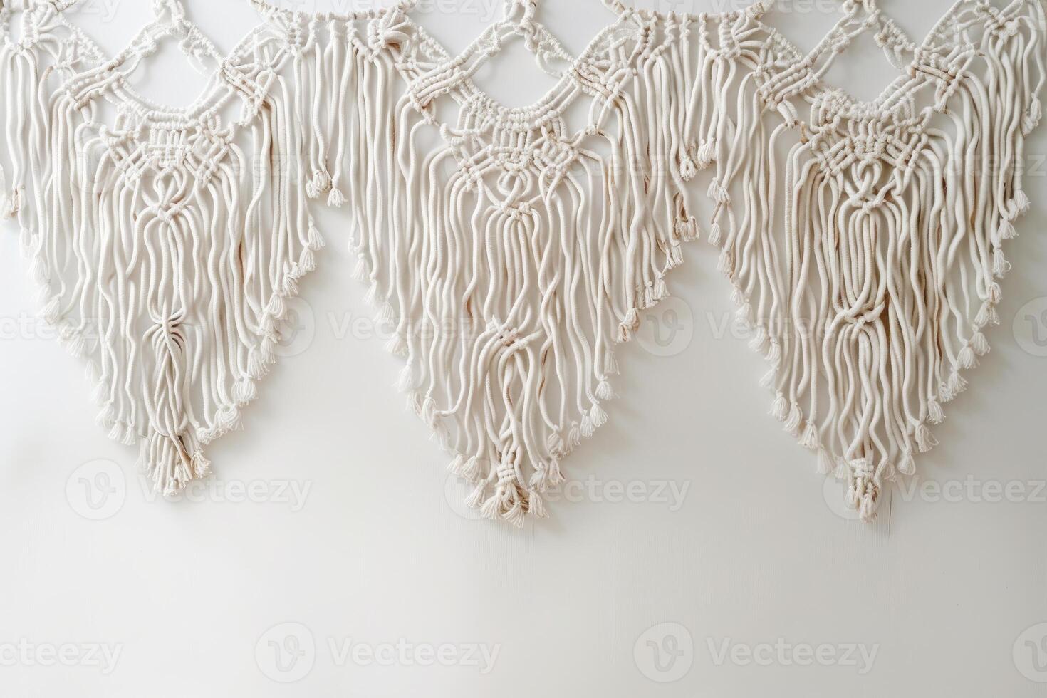 Boho chic macrame decor against a soft transparent white backdrop, ideal for bohemian designs photo