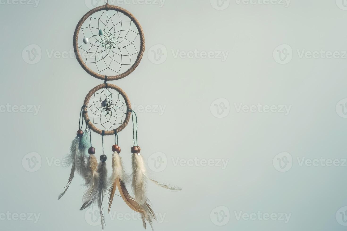 Bohemian dreamcatcher decoration against a soft transparent white surface, adding a touch of mystique photo
