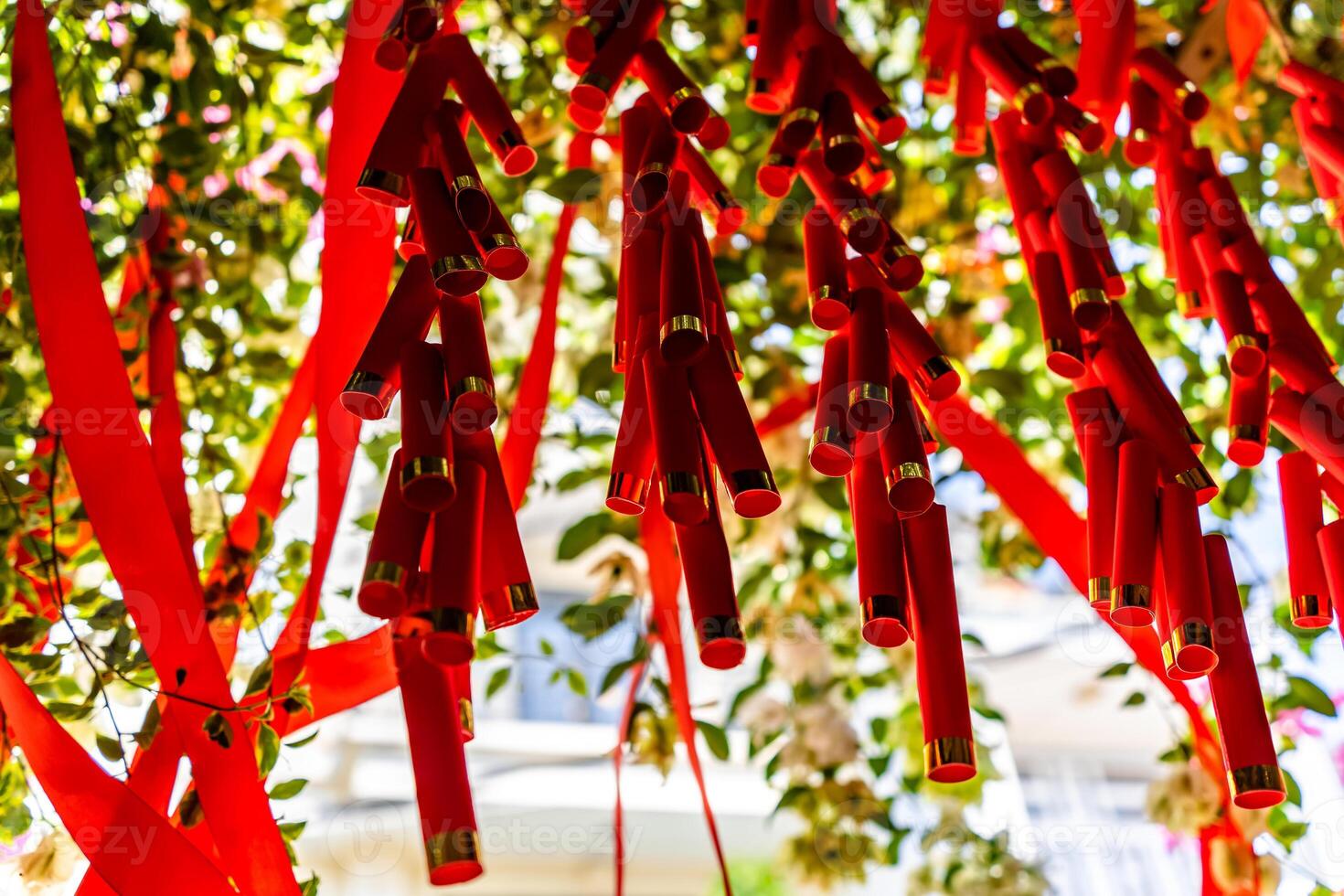 Chinese New Year Decoration--Firecrackers with a blurry background.Character on background symbolizes good luck. photo