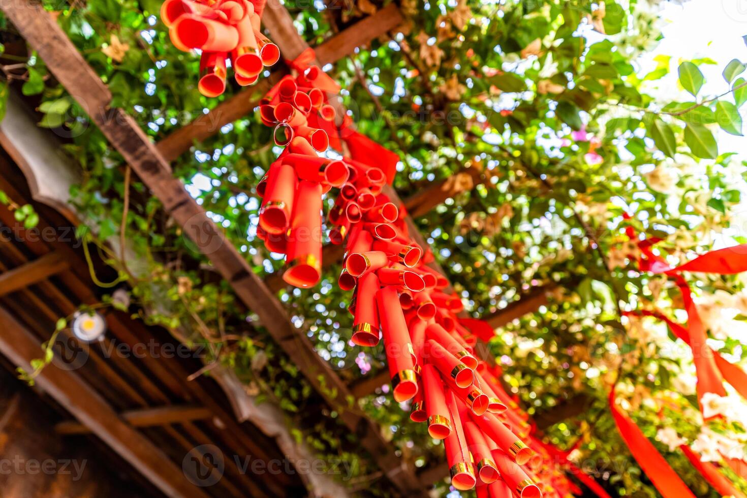 Chinese New Year Decoration--Firecrackers with a blurry background.Character on background symbolizes good luck. photo