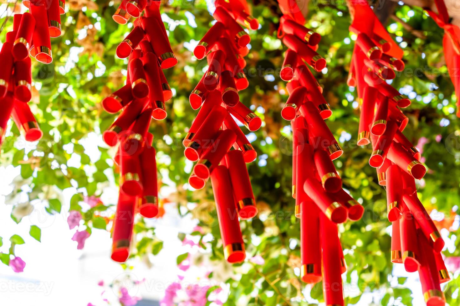 Chinese New Year Decoration--Firecrackers with a blurry background.Character on background symbolizes good luck. photo