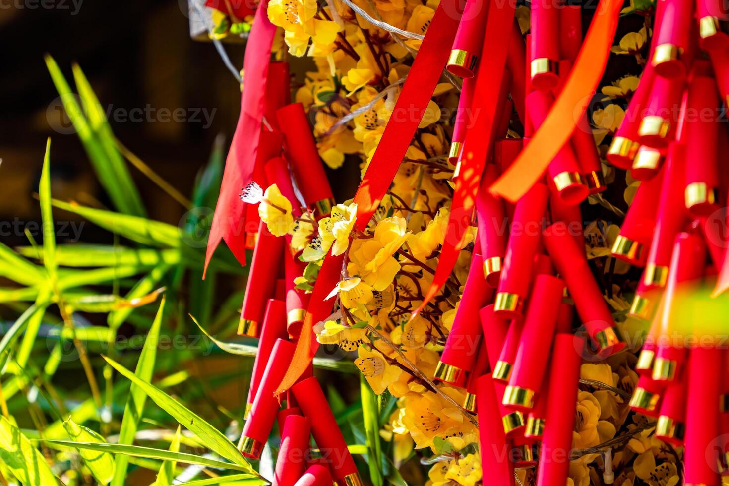 Chinese New Year Decoration--Firecrackers with a blurry background.Character on background symbolizes good luck. photo