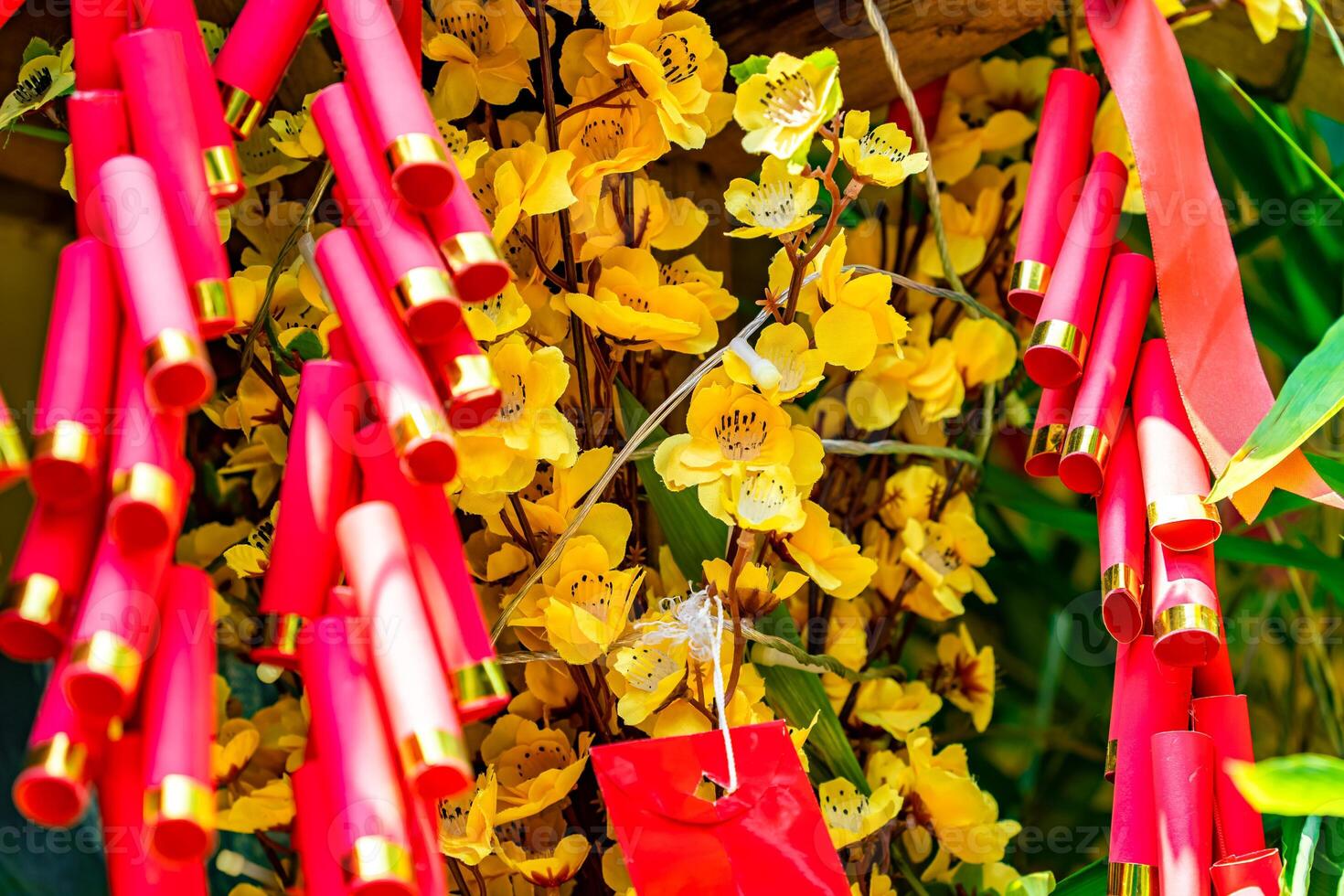 Chinese New Year Decoration--Firecrackers with a blurry background.Character on background symbolizes good luck. photo