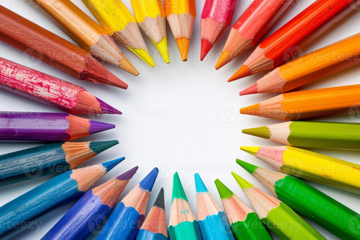 Rainbow-colored crayons arranged transparently in a circular pattern photo