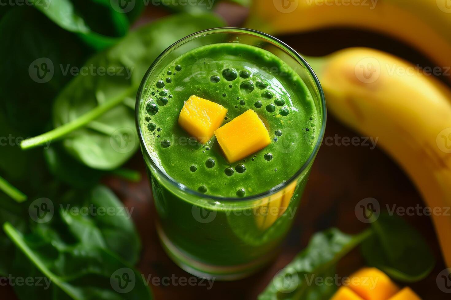 Close-up of a smoothie made with spinach, mango, banana, and coconut water, a nutritious and energizing beverage photo