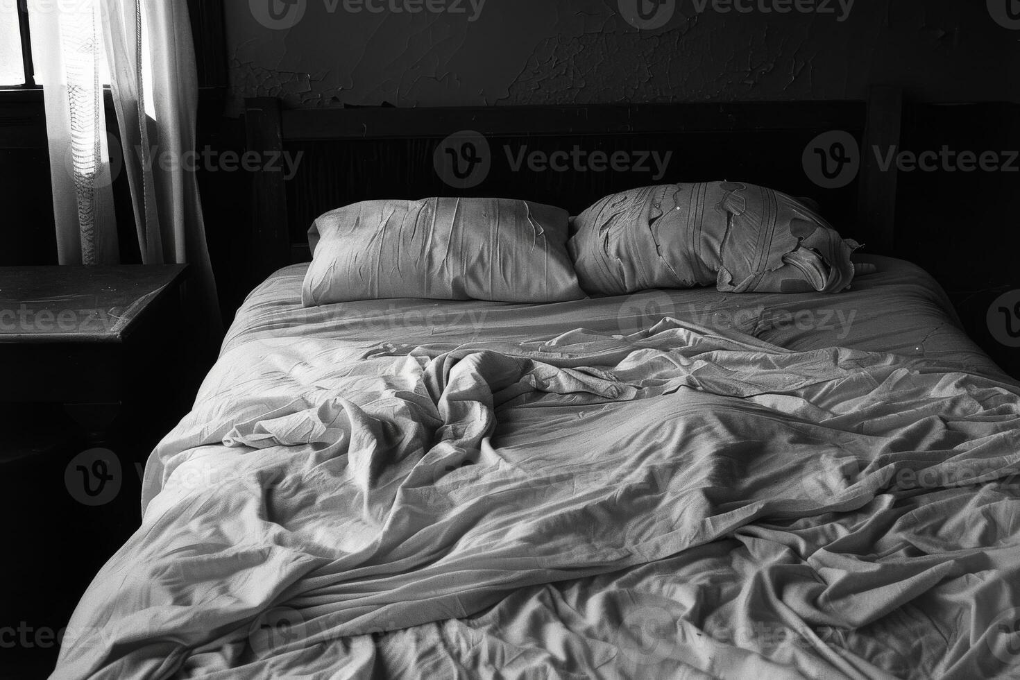 Empty bed with rumpled sheets, symbolizing the restlessness of insomnia photo