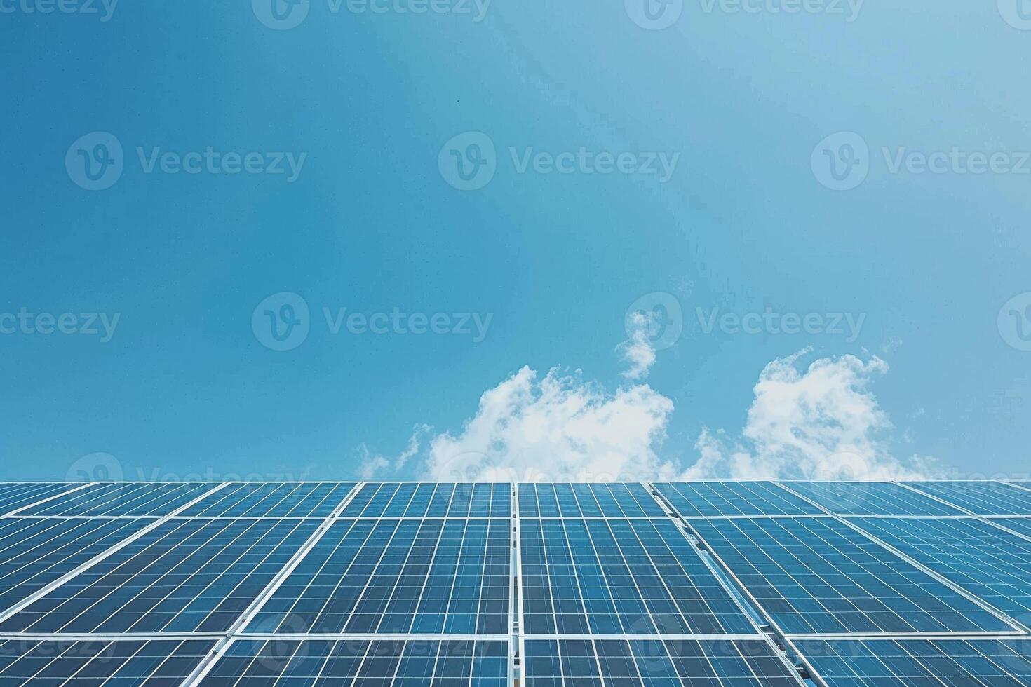 Solar panels against a clear blue sky, harnessing renewable energy for a greener future photo