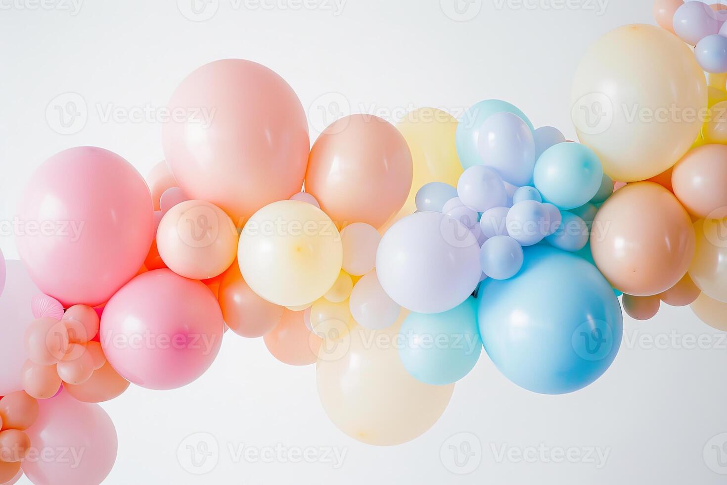 Cluster of pastel-colored balloons in various shapes and sizes, perfect for birthday parties photo