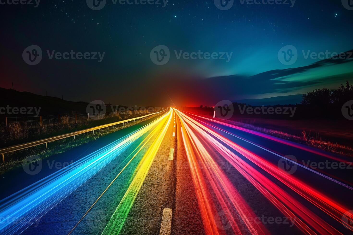 Rainbow-colored light trails transparently streaking across the night sky photo
