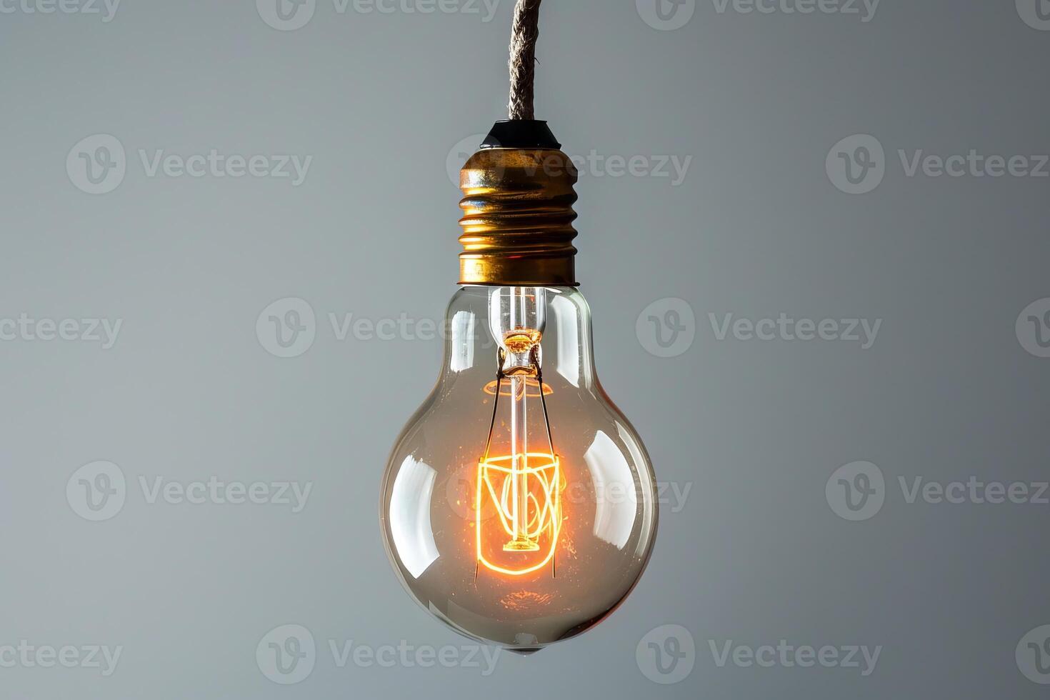 Vintage light bulb glowing warmly against a soft transparent white backdrop, adding a touch of nostalgia to compositions photo