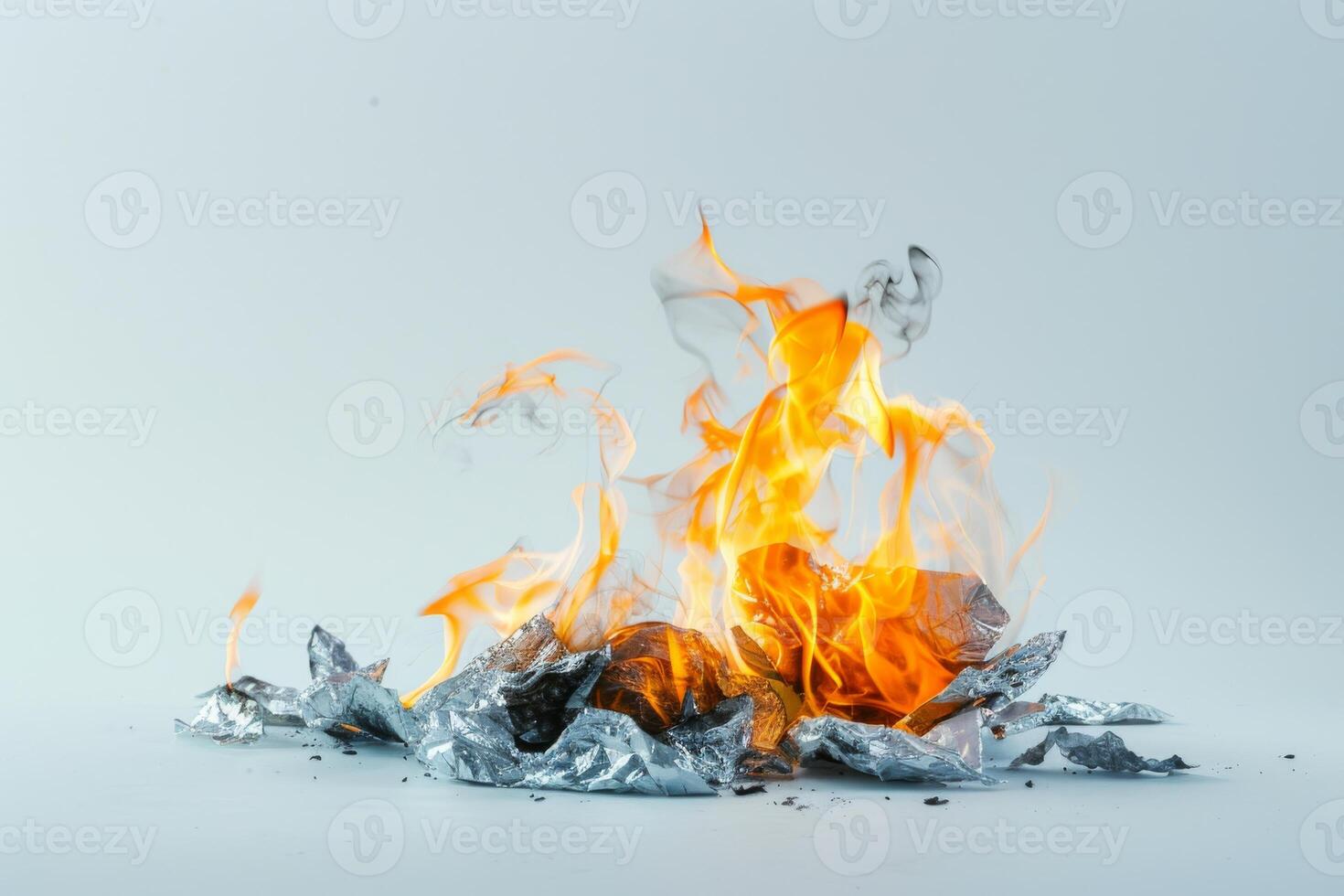 Burning paper engulfed in flames against a transparent white backdrop, symbolizing destruction and transformation photo