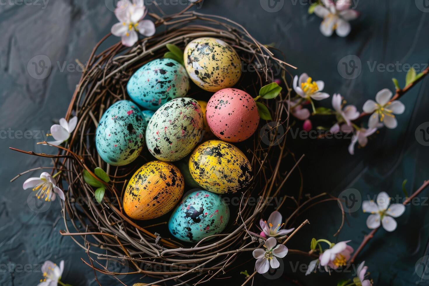 Colorful Easter eggs arranged in a nest with spring blossoms photo