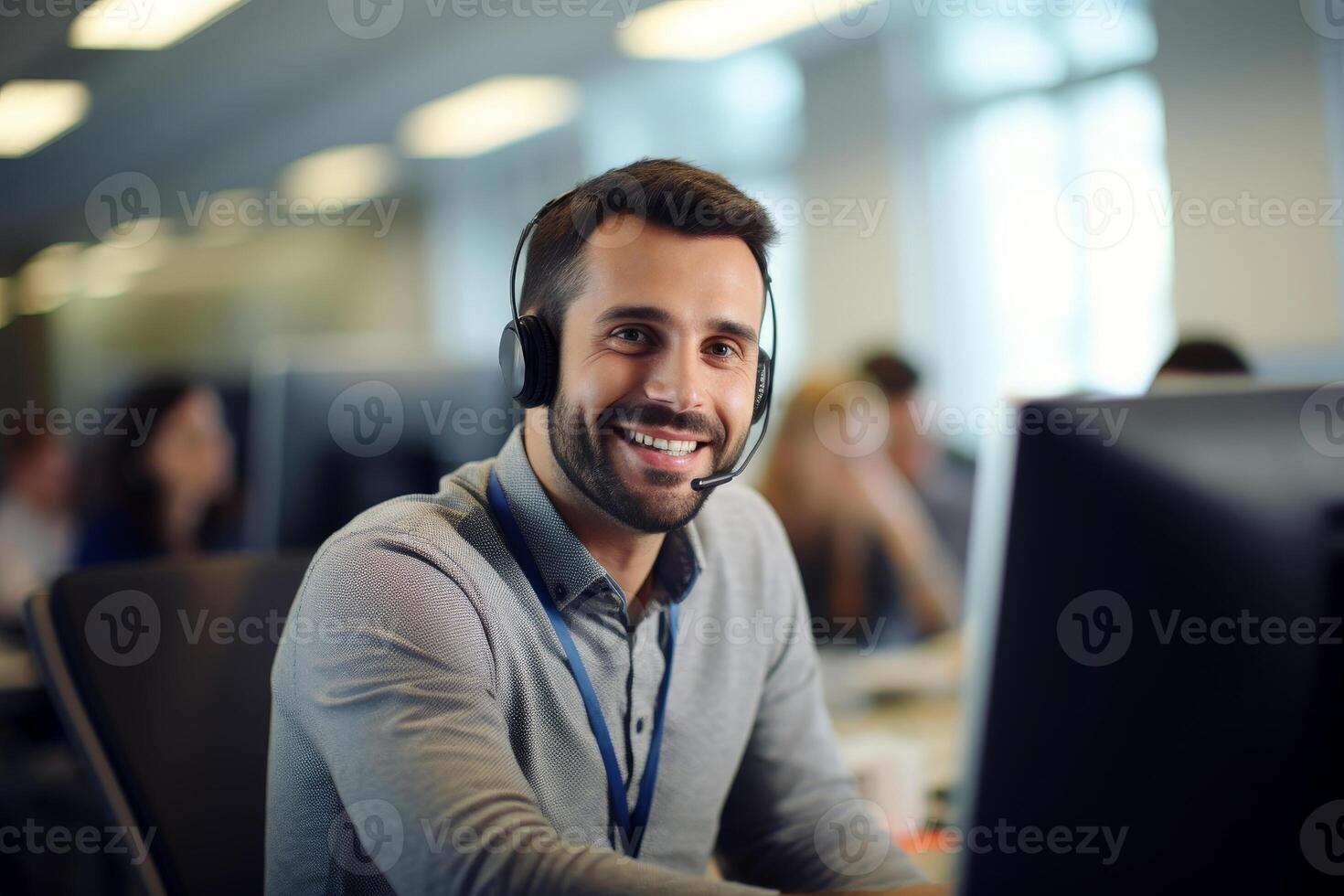 A man in a suit and tie is smiling and wearing a headset. call center . photo