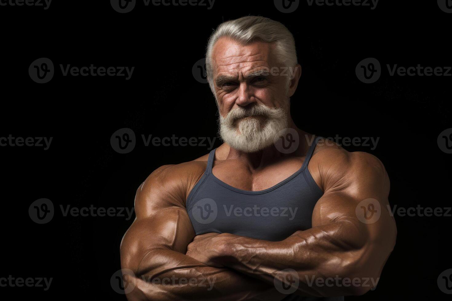 A elder man with a beard and a muscular build is posing for a photo. photo