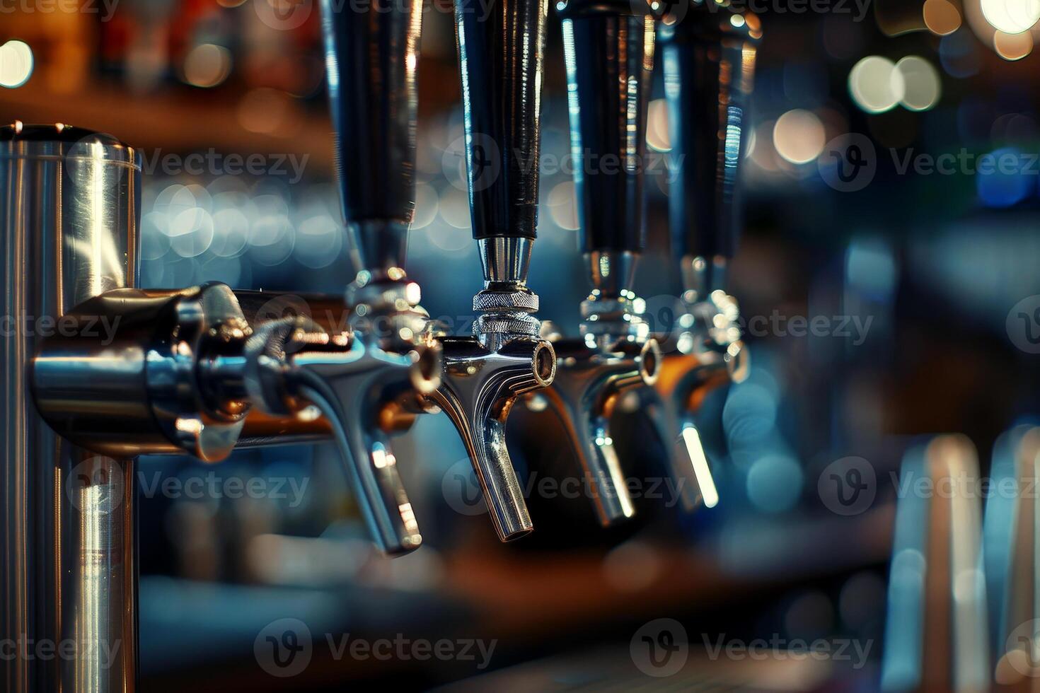 Closeup of beer tap handles lines in a bar against a dark background photo