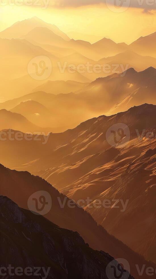 Mountain ridges bathed in the golden light of dawn photo