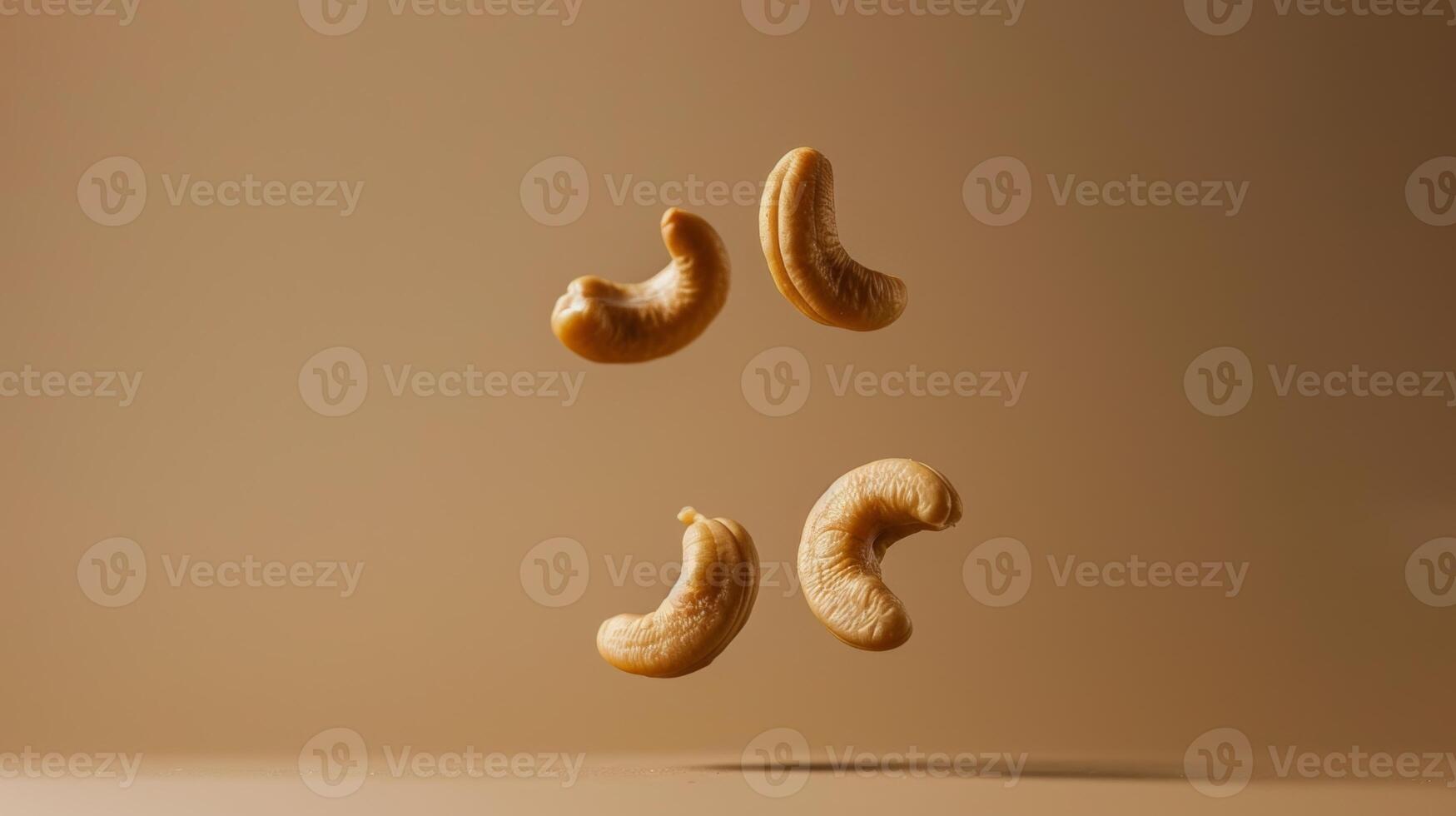 Minimalist shot of floating cashew in a minimalist brown composition photo