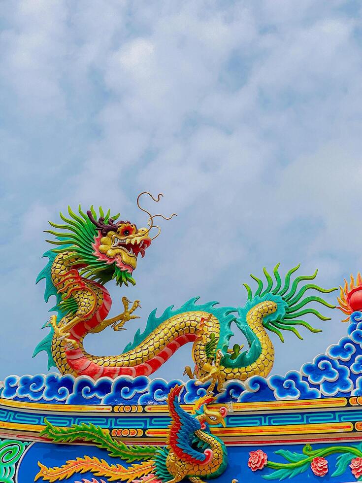 Dragon statue, dragon symbol, dragon Chinese, is a beautiful Thai and Chinese architecture of shrine, temple. A symbol of good luck and prosperity during the Chinese New Year celebrations. photo