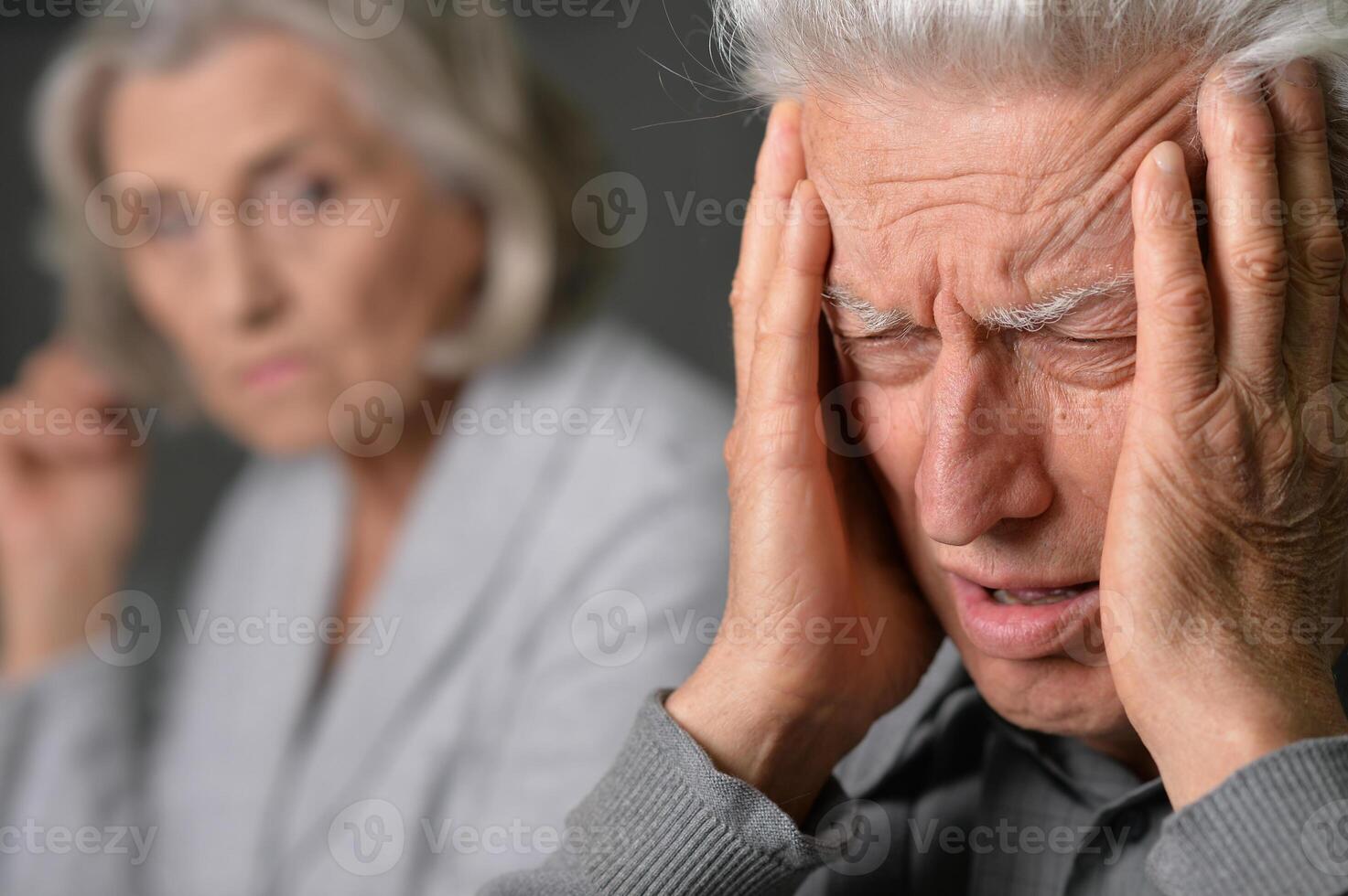 Portrait of sick elderly couple at home photo