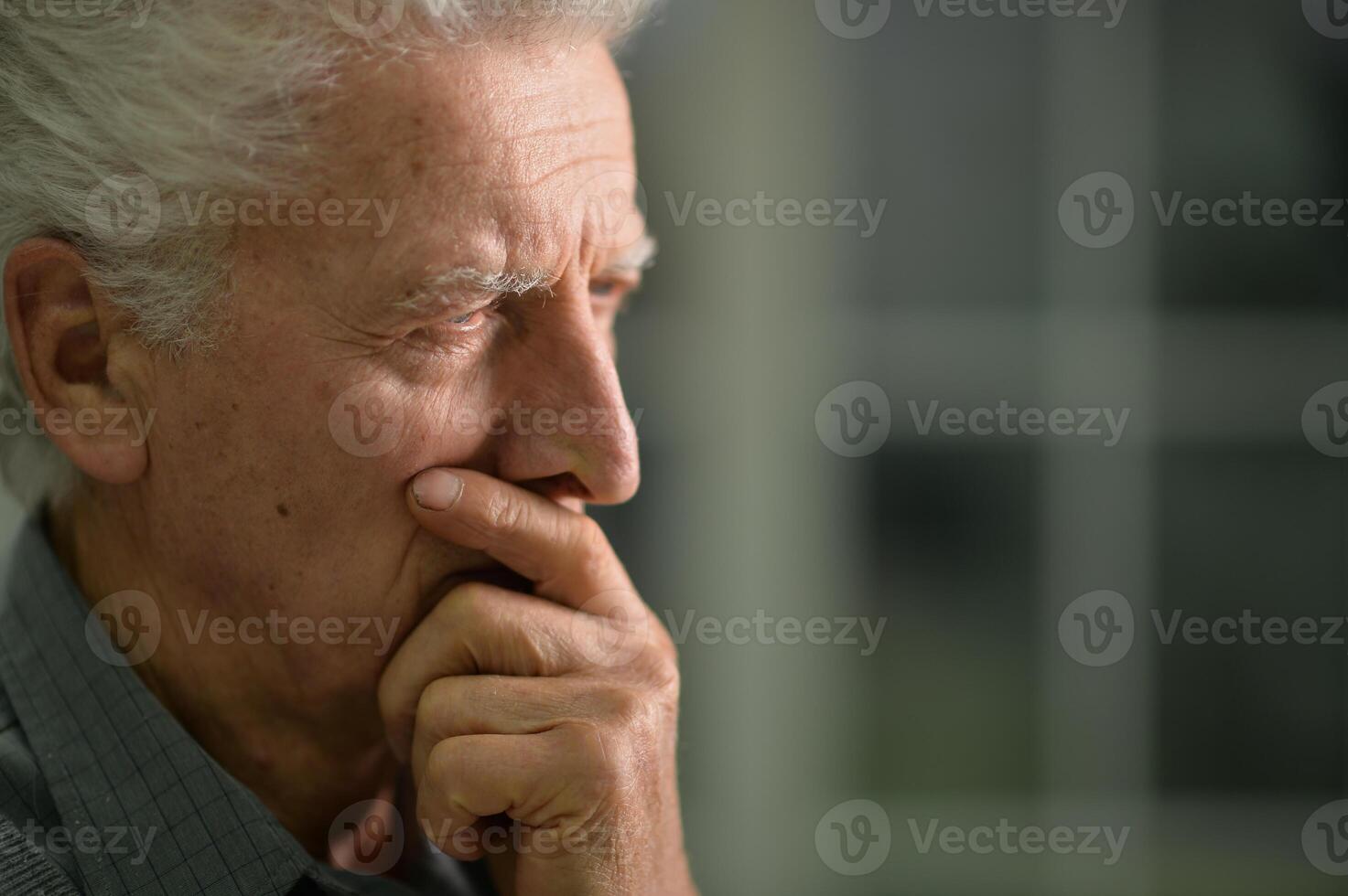 Portrait of a thoughtful senior man close-up photo