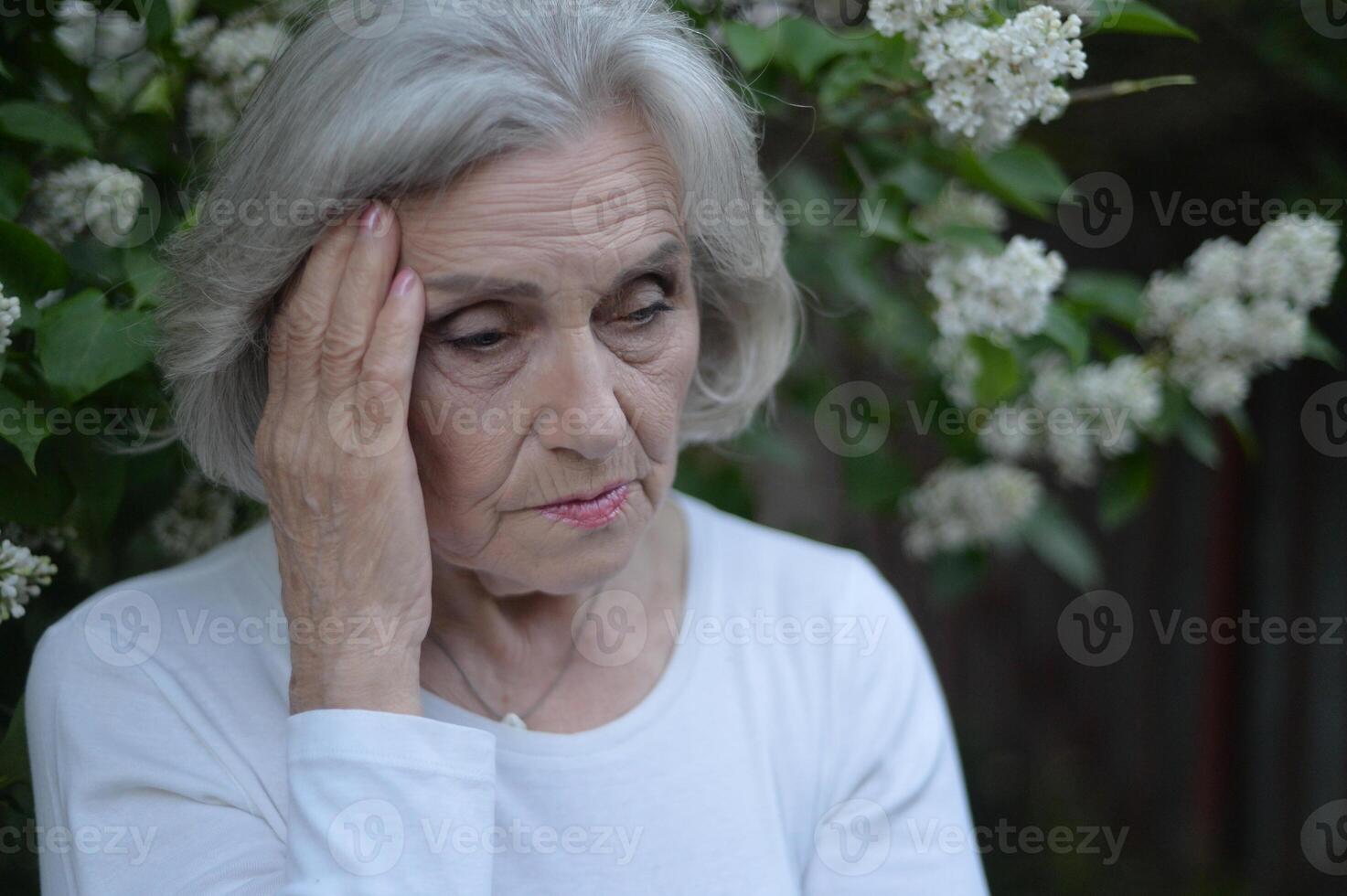 Close up portrait of sad senior woman photo