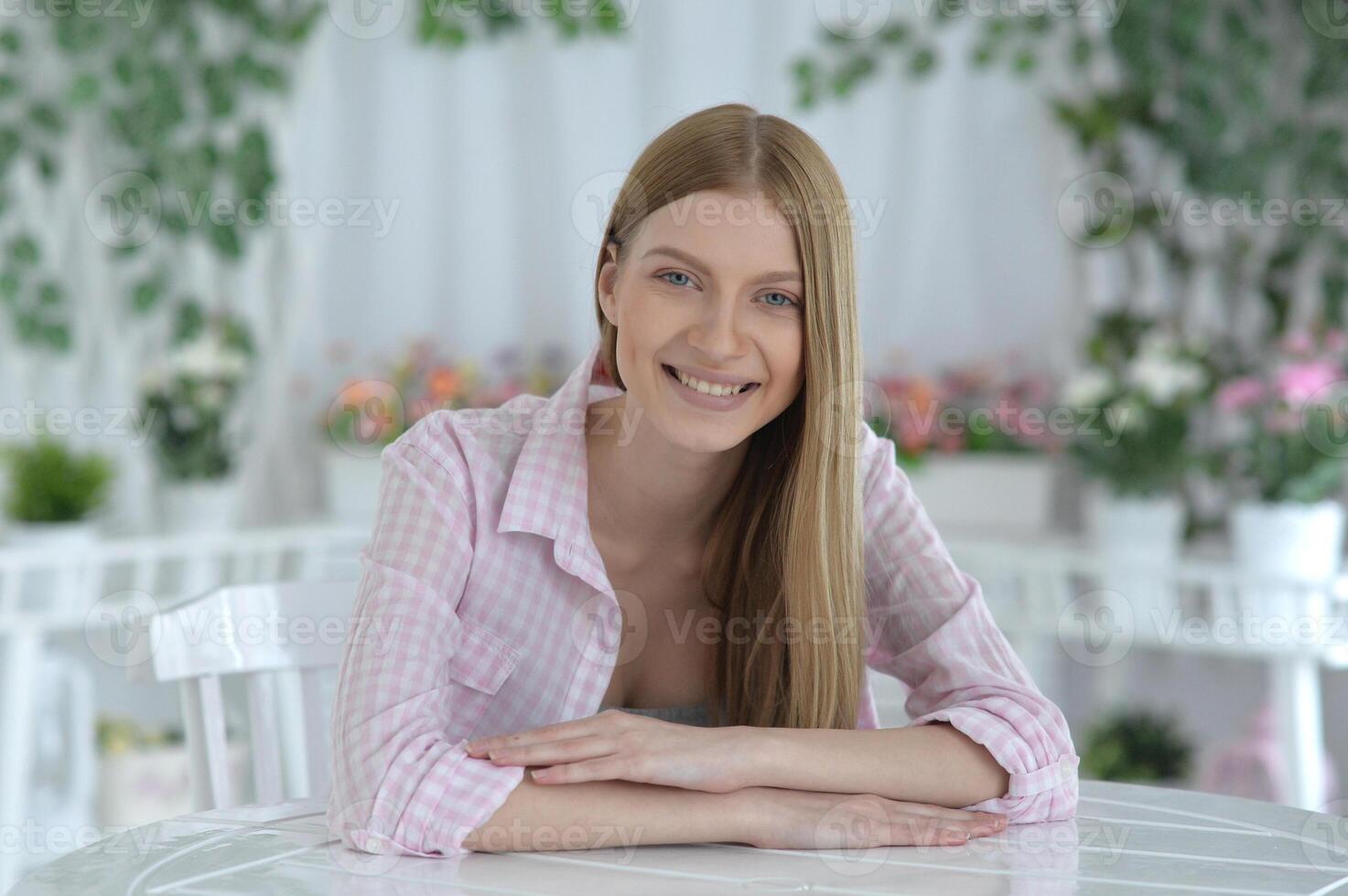 Portrait of young woman with deep blue eyes photo