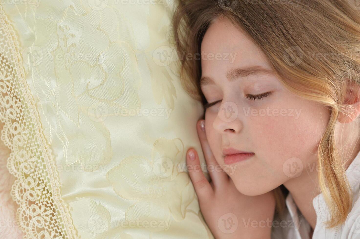 Adorable cute little girl sleeping in bed photo