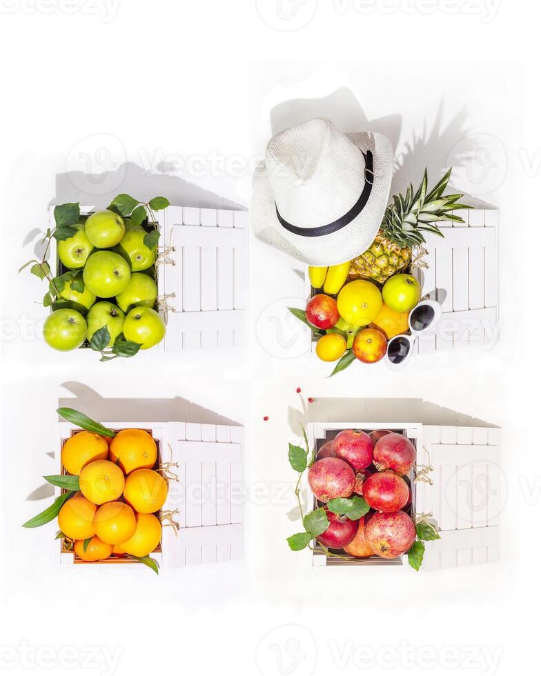Vertical composition with seasonal, organic fruit in white boxes on a white background photo