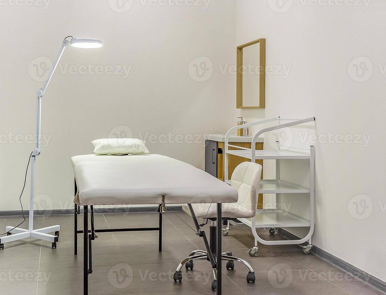 White interior of a modern cosmetology room in a beauty salon photo