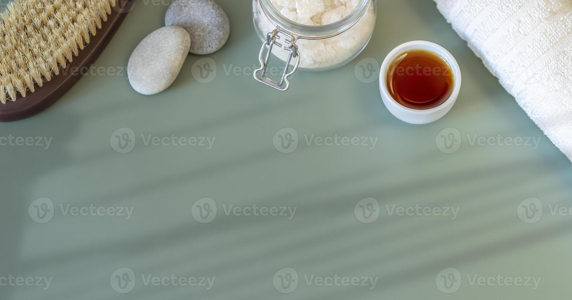 Flat lay composition with natural cosmetic products, stones and towel photo