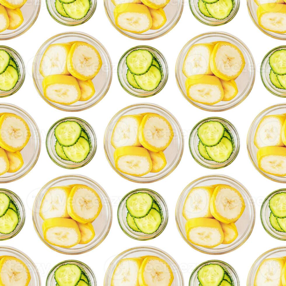 Seamless pattern of banana and cucumber slices on a white background photo