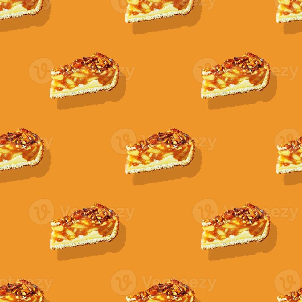 Seamless pattern with isolated appetizing piece of apple pie with pecans photo