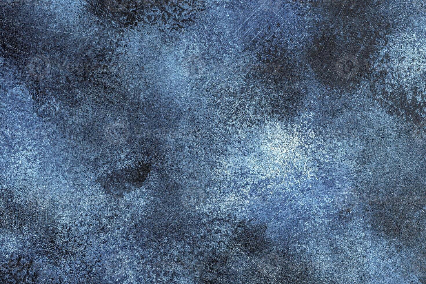 Blue abstract texture background of painted and scratched surface photo