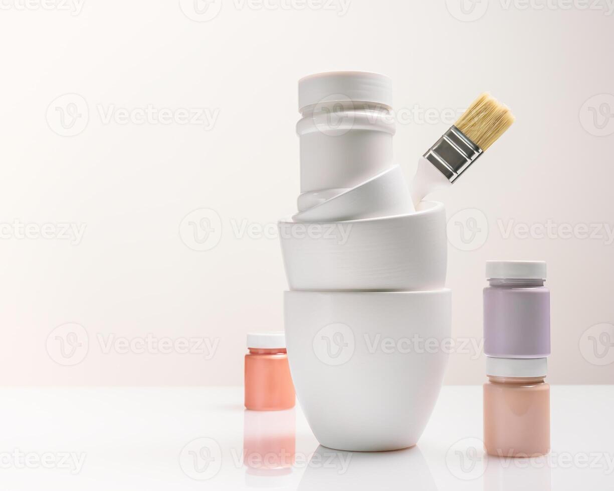 Paint cans, jars and a brush on a light background with copy space photo