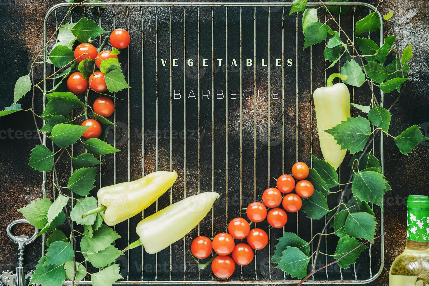 Season, farm vegetables on the grill with sprigs of greenery, a bottle of white wine and a corkscrew photo