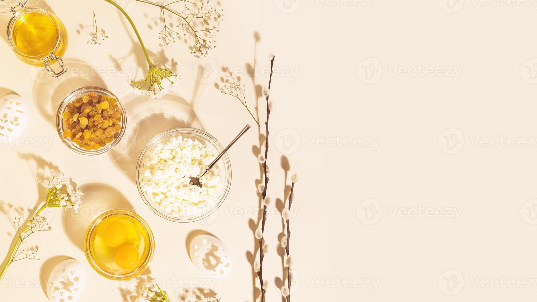 Ingredients for making Easter cake with white flowers photo